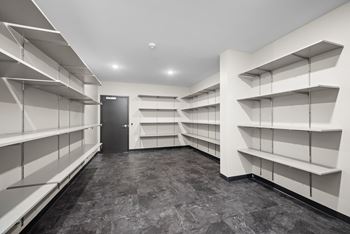 Empty white shelves in a room at The Landing at Amber Fields Apartments, Rosemount
